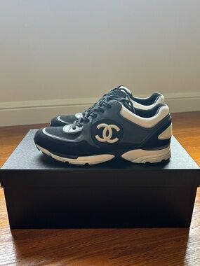 CHANEL Black classic sneakers/ trainers.